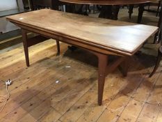 A 1960s teak rectangular metamorphic coffee table, with moulded edge, with rise and fall movement,