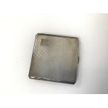 A Birmingham silver engine turned cigarette case with initials EML and the date May, 1944 engraved