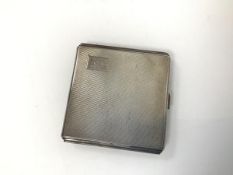 A Birmingham silver engine turned cigarette case with initials EML and the date May, 1944 engraved