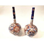 A pair of Imari style flask vases (h.25cm x 12cm) and a blue and white transfer printed plate (d.