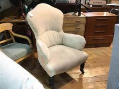 A Victorian mahogany framed drawing room easy chair with arched button back, arms and seat, in