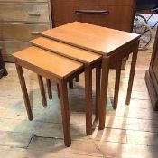 A Mackintosh teak 1970s/80s nest of three coffee tables, the rectangular tops with moulded edge on