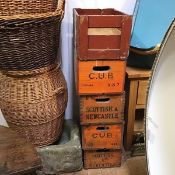 A collection of beer crates including Cub, Carlsberg, Scottish & Newcastle Breweries and a Stork