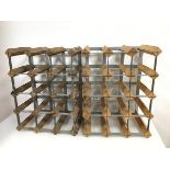 A pair of wine bottle racks with wooden and metal frames, each for twelve bottles (a/f) (44cm x