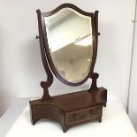 An Edwardian dressing table hinged mirror, with shield shaped bevelled glass plate in mahogany