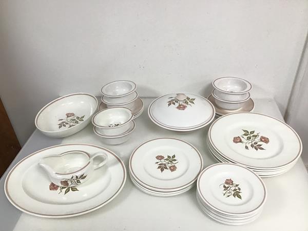 A Wedgwood Susie Cooper dinner service including six dinner plates (d.27cm), six soup bowls (one a/