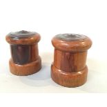 Two 19thc hardwood string cannisters with moulded tops and screw out bases (14cm x d.12cm)