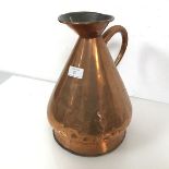 A copper flagon with flared rim and spout, with handle to side (31cm x 21cm)