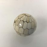 An unusual, possibly 19thc., Indian bone ball, formed of multiple polygon bone panels (d.5cm)