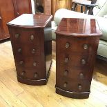 A pair of 19thc bedside cabinets, formerly the supports for a pedestal desk, each fitted single door