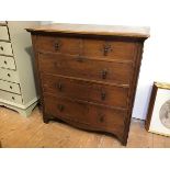 A 1930s/40s oak chest of drawers, fitted two short drawers over three long drawers, with tassel