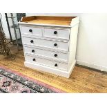 A modern pine ledgeback baby changing station/chest, fitted two short and three long drawers on