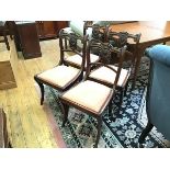 A set of four Scottish Regency dining chairs in Grecian style, each with moulded and scroll back