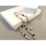 A strand of Jersey cultured pearls including black and silver pearls etc. (23cm), and a similar pair
