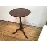 A modern George III style pedestal wine table, with circular saucer top on fluted turned tapered