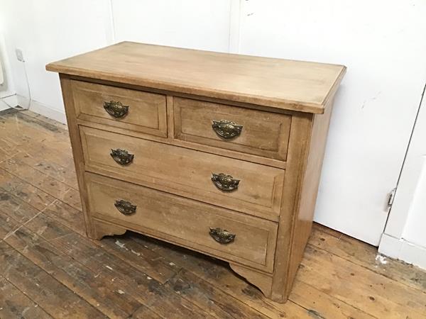 An Edwardian ash chest, the rectangular top with moulded edge above two short and two long