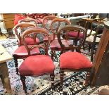 A harlequin set of four Victorian mahogany balloon back style dining chairs and two similar dining