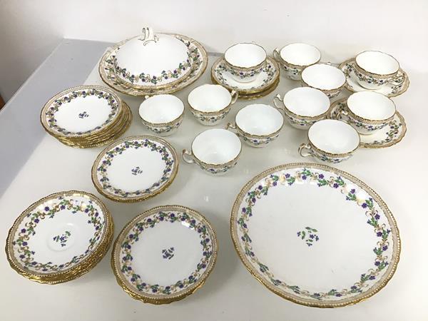 A late 19thc Minton teaset, including eleven teacups and saucers, side plates, serving dish (d.