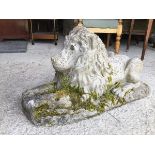 A garden ornament in the form of a composition Recumbent Lion (33cm x 64cm x 32cm)