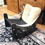 A modern ebonised rocking chair, with fabric arm straps and rubber seat (71cm x 62cm x 77cm)