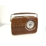 A Bush retro style radio, with imitation wood exterior (28cm x 35cm x 10cm)