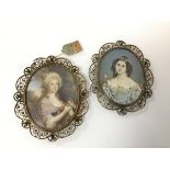 A pair of 19thc portrait miniatures of ladies, one signed to right, Fabry, the other with tag