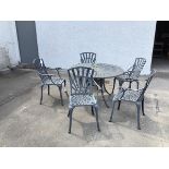 A metal garden table and five chairs, all with a sunburst design (a/f) (table: d.120cm x h.75cm)