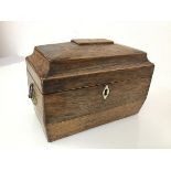 A 19thc. rosewood sarcophagus tea caddy, the hinged lid with metal shield plaque, with family