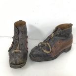 A pair of vintage heavy duty boots (30cm x 17cm x 12cm)