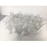 A collection of assorted stemware glasses, with a variety of cuts, including white wine glasses,