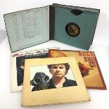 A record album with twelve vinyl records including The Inkspots, Frank Sinatra, Jimmy Shand and