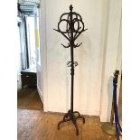 An Art Nouveau style hallstand, with acorn finial above a knotted eight peg coat hanger (h.185cm)