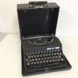 An Invicta Italian typewriter, with travelling case bearing label W. Simpson Bell & Co.,