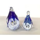 Two cased glass penguins with king penguin and adelie penguin (tallest: 16cm)