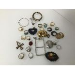 An assortment of costume and silver jewellery including a silver Egyptian style ankh, rings, buckle,