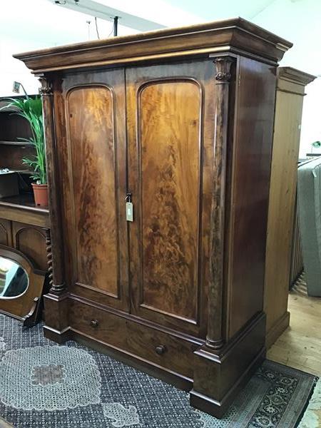A handsome Victorian mahogany wardrobe, the moulded cornice above two panelled doors, flanked by
