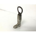 A novelty bottle opener in the form of a boot, marked sterling to heel (10cm) (41.05g)