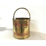 A brass copper banded coal bucket with swing handle to top (29cm x 29cm)