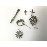 An Iona silver brooch, stamped IMC verso (3cm x 3cm), a silver sun pendant, a silver brooch of