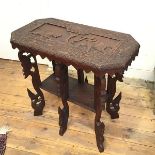 An Anglo Indian teak carved octagonal occasional table, with elephant and tiger design enclosed