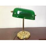 A banker's lamp with hand blown green glass shade on fluted brass column on circular base (36cm x