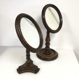 A pair of Victorian shaving or dressing table mirrors, one with circular glass, the other oval, both