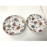 An unusual pair of 19thc dishes, each with a polychrome pixellated floral design, with other
