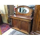 A Victorian mahogany dresser base, with moulded edge above two panelled doors, the interior fitted