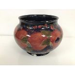 A Moorcroft pottery jardiniere of bulbous spherical form, with tube lined decoration in the