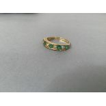 An 18ct gold five stone emerald and four stone diamond ring, mounted in rubover setting (R), each