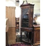 An Edwardian mahogany Georgian style corner cabinet on stand, with painted shell and inlay