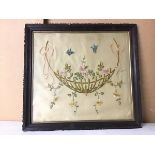 An Edwardian panel embroidered with a Flower Basket with Butterflies (46cm x 51cm)