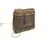 An African woven basket on wooden plinth base (32cm x 35cm x 16cm)