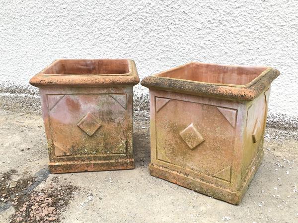 A pair of terracotta garden planters, with lozenge decoration (37cm x 36cm x 36cm)